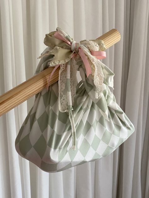 DIY bindle bag made from sage green and white checkerboard stretchy fabric and tied up with various ribbons and lace. Bindle Bag, Ribbon White, Second Hand Shop, Dnd Stuff, Diy Ribbon, Big Adventure, Diy Bag, White Bag, Green And White