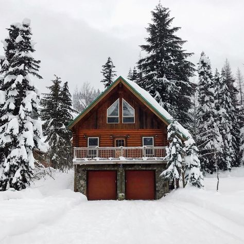 Rustic A Frame With Garage Underneath, Cozy Winter Cabin Exterior, A Frame House With Garage Underneath, Cabin With Garage, House With Garage Underneath, Hillside Building, Log Cabin With Garage, Winter Cabin Exterior Big, Log Home Garage Addition