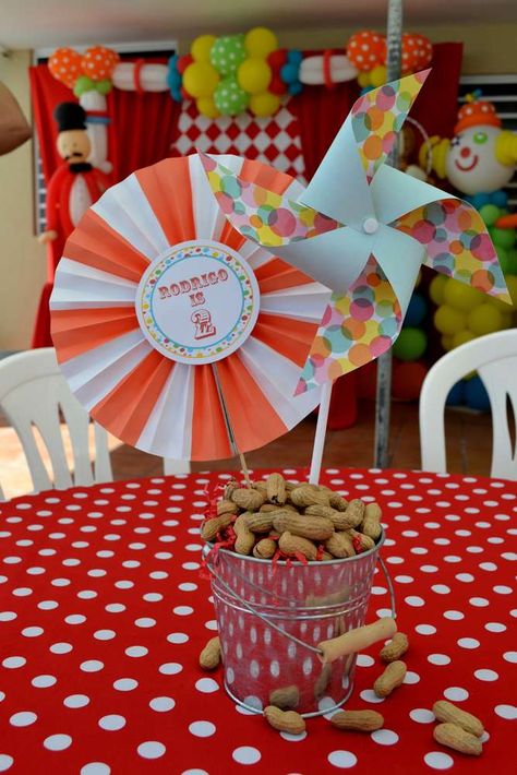 {Carnival Birthday} | CatchMyParty.com Carnival Birthday Centerpieces, Carnival Table Decorations, Peanut Centerpiece, Carnival Centerpieces, Circus 1st Birthdays, Circus Birthday Party Theme, Tin Buckets, Birthday Party Table Decorations, Carnival Birthday Party Theme