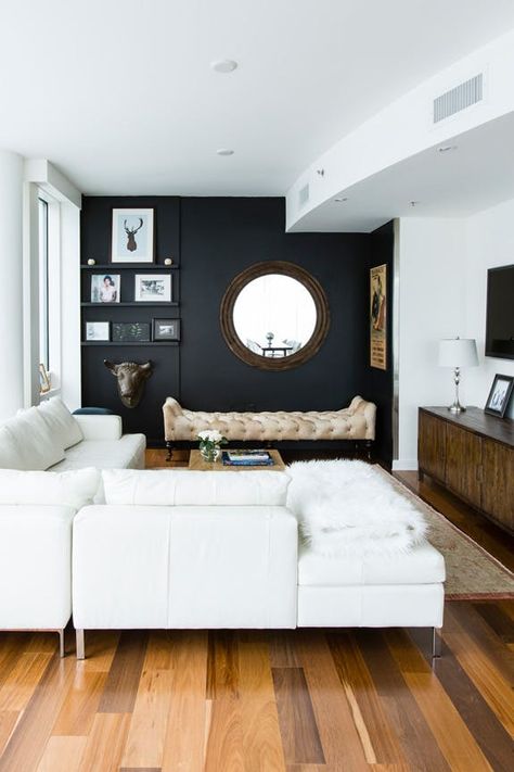 High Contrast: A Design Trick That Makes Small Spaces Seem Larger Dark Accent Wall, Make A Room Look Bigger, Room Look Bigger, Dark Accent Walls, Furnitur Ruang Keluarga, Black Accent Walls, Minimalist Living Room Design, Make A Room, Modern Minimalist Living Room