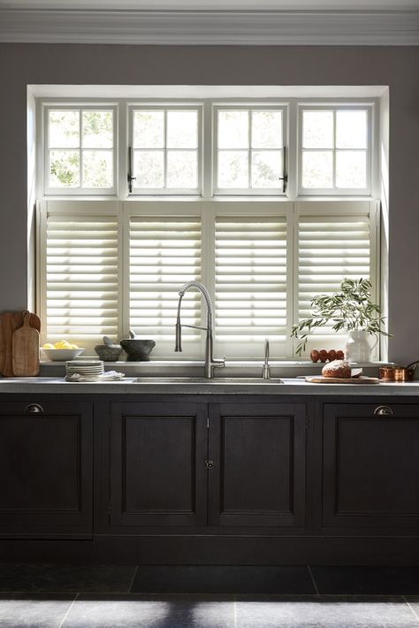 Looking for ways you can maximize the light in your kitchen diner? Window dressing is important to get right in your kitchen. Shutters are a great kitchen window dressing idea to consider for maximum light control. Window Treatments Kitchen Sink, Kitchen Window Over Sink Ideas, Kitchen Window Shutters, Kitchen Window Dressing, 2023 Apartment, Cafe Style Shutters, Window Options, California Shutters, Window Over Sink