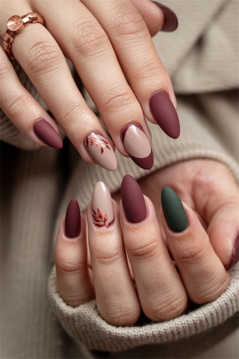 Dive into the season with these elegant matte oxblood nails, a striking choice among fall nail ideas. This deep, rich color perfectly captures the essence of autumn while the matte finish adds a sophisticated twist. Paired with subtle gold accents or delicately placed geometric designs, your nails will be a stunning reflection of fall's beauty. Discover how this unique style can elevate your autumn aesthetic! Matt Autumn Nails, Fall Season Nails Matte, Simple Fall Nails Autumn Matte, Autumn Nails With Gold, Auburn Nails Designs, Burgundy Nail Designs Fall, Fall Autumn Nail Designs, Aesthetic Autumn Nails, Matte Fall Nails Short