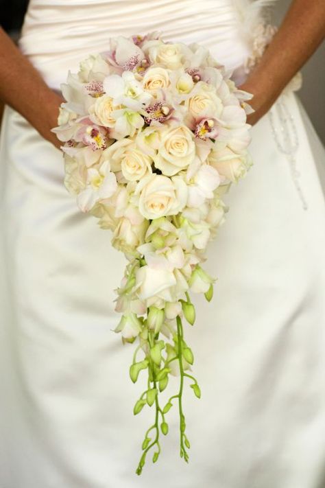 Bride's Elegant Teardrop/Cascade Bouquet: White/Pink Cymbidium Orchids, White Orchids + Buds, Cream Roses Bouquets Peonies, Popular Wedding Flowers, Flowers Guide, Trailing Bouquet, Wedding Planning Boards, Unique Wedding Bouquet, Red Bouquet Wedding, Traditional Roses, Lace Wedding Cake