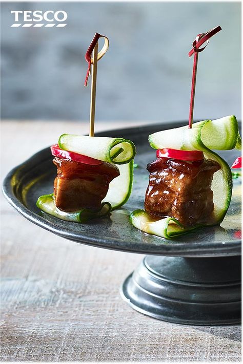 Impress your guests at your next drinks party with this easy pork belly canapé recipe. Inspired by Asian flavours, sticky hoisin pork belly squares are skewered with spicy chilli and refreshing cucumber. | Tesco #pork #canapes Pork Belly Skewers, Easy Pork Belly, Canapé Ideas, Sticky Pork Belly, Canapes Ideas, Week Meals, Dish Design, Tapas Party, Sticky Pork