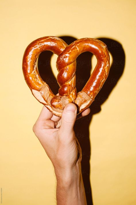 Hand Holding Heart-shaped Pretzel by Di Na - Pretzel, Octoberfest Soft Pretzel Aesthetic, Hands Holding Heart, Holding Heart, Soft Pretzels, Hand Holding, Pretzels, Food Recipe, Hydrangea, Holding Hands