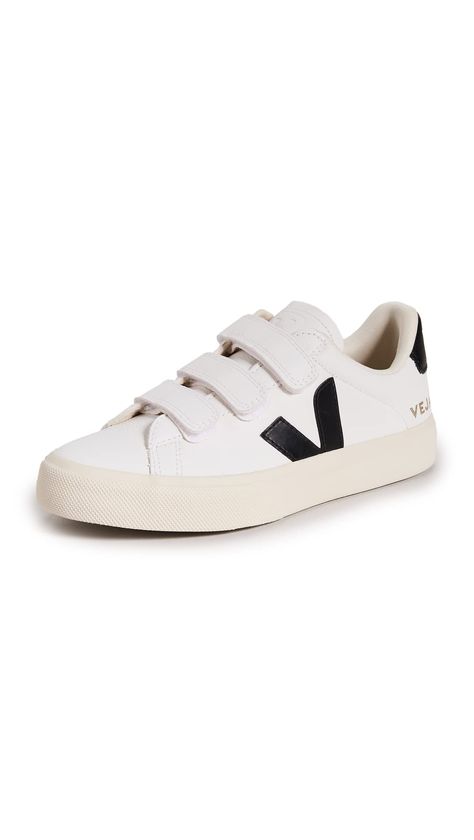 PRICES MAY VARY. Jersey lining is made from cotton and recycled polyester, Sole made of Amazon rubber, rice waste, and recycled rubber, ChromeFree leather, Designed on a unisex shoe last using European sizing, Removable cushioned insole Velcro closures Leather: Cowhide Made In Brazil Always a favorite label for go-anywhere shoes, Veja delivers again with these Recife sneakers. They're designed with Velcro closures for a touch of retro style, and feature high-contrast trim in black leather. Shoes Veja, Veja Shoes, Velcro Shoes, Work Sneakers, Velcro Sneakers, Veja Sneakers, Shoe Last, Recycled Rubber, Unisex Shoes