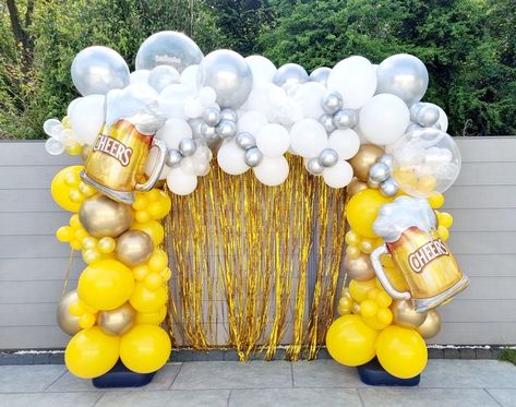 Yellow and white organic balloon arch with beer foil balloons Beer Party Theme Decorations, Beer Mug Balloon Arch, Cheers To Beers Party, Beer Festival Decorations, Beer Backdrop Ideas, Beer Fest Birthday Party, Bubbles And Brews Balloon Arch, Beer Theme Balloon Garland, Cheers And Beers Balloons Garland