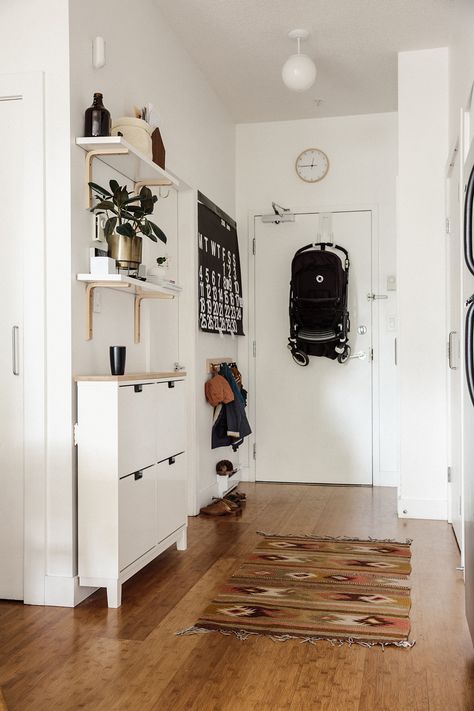 A 600-Square-Foot Vancouver Family Home. Like the shelves and brackets and use of IKEA spice racks. Small Hallway Ideas Entrance Halls, Hallway 2023, Ideas For Small Apartments, Vstupná Hala, Apartment Entryway, Small Entryways, Decor Ikea, Entryway Ideas, Hallway Storage