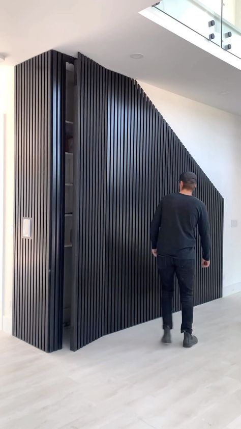 ideal design op Instagram: "Slat wall hidden doors One of the easiest ways to have a hidden door is with vertical slats. Custom 10’ doors hung with @sugatsunecanada 3…" Genkan Ideas, Vertical Slats Wall, Hidden Doors In Walls, Push Latch, Hidden Closet, Vertical Slats, Hidden Doors, Invisible Doors, Entryway Closet