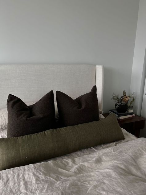 The Umber Bouclé Pillow showcases the perfect shade of brown boucle in a true chocolate tone. The bouclé finish gives a high-textured appeal, matching perfectly with contemporary and modern decor. Available as a square or body pillow perfect as a finishing touch to any bed. Includes a Duck Feather/Down blend pillow insert. Boucle Bed Bedroom Ideas, Bedroom Bed Pillow Ideas, Body Pillow On Bed Ideas, Decorative Bed Pillows Ideas, Green And Neutral Bedroom, Chocolate Bedroom Ideas, Bedroom Decor Brown, Masculine House, Boucle Bed