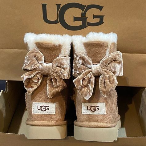 "Add a touch of sweetness to your winter wardrobe with these adorable bow-accented Uggs! Stay cozy and cute all season long! ❄️🎀" Cute Uggs, Ugg Mini Bailey, Uggs With Bows, Fluffy Shoes, Ugg Store, Pink Uggs, Mini Baileys, Trendy Shoes Sneakers, Preppy Shoes