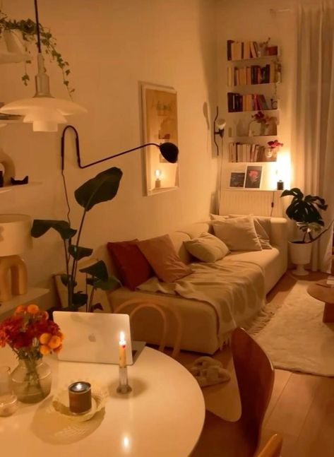 Cozy Living room Aesthetic Idea | warm living room, dim lighting Minamilstic Living Room, Tiny Dinner Table, Cute Living Room Apartment, Living Room Inspiration Earth Tones, Neutral Color Apartment Decor, Dream Apartment Aesthetic Cozy, Low Light Apartment Decorating Ideas, Soft Lighting Apartment, Modern Vintage Decor Living Room Small Spaces