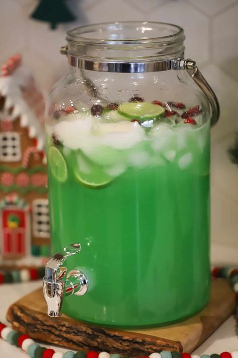 Grinch Punch Grinch Punch With Kool Aid, Grinch Christmas Punch Recipes, Punch Alcoholic Party, Green Rum Punch, Grinch Punch Nonalcoholic, Big Batch Grinch Cocktail, Grinch Punch Recipe For Kids No Sherbert, Punch With White Grape Juice, Grinch Punch With Alcohol