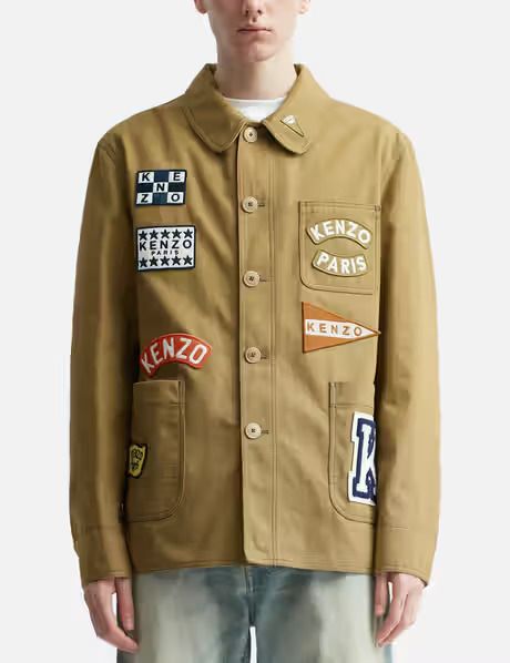 KENZO Sailor Workwear Jacket Men's S Khaki Collared Long Sleeve Button Closure KENZO Sailor Workwear Jacket Men's S Khaki Collared Long Sleeve Button Closure Retail $1,195.00  This Kenzo 'kenzo Sailor' Work Jacket is a stylish and functional addition to any wardrobe. Made from 100% cotton with a patchwork pattern, this jacket features a button closure and comes in a khaki color. It is perfect for workwear and walking during the fall and spring seasons. The jacket is designed with a collared neck Fashion Workwear, Japanese Workwear Vintage, Vintage Varsity Jacket, Japanese Workwear, British Style Men, Workwear Vintage, Workwear Jacket, Cargo Jacket, Patches Jacket