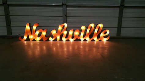 Lighted Nashville sign  63 by 13 inches  Its perfect for your house, bar, or any outdoor or indoor area. It is great quality.  Ask about custom signs!  Check out our stuff!!!!   https://www.etsy.com/shop/GardenMetalDecor   Thank you for visiting our store Nashville Sign, Marquee Signage, House Bar, Marquee Sign, Marquee Lights, Light Up Signs, Cursive Font, Marquee Letters, Wood Ideas