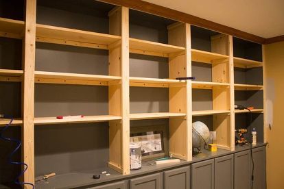 How to make your own custom built-ins with cheap cabinets - It makes the space so comfy. Diy Built In Shelves, Make Your Own Book, Tv Kastenwanden, Cheap Cabinets, Unfinished Cabinets, Office Remodel, Closet Organization Diy, Custom Built Ins, Bookshelves Diy