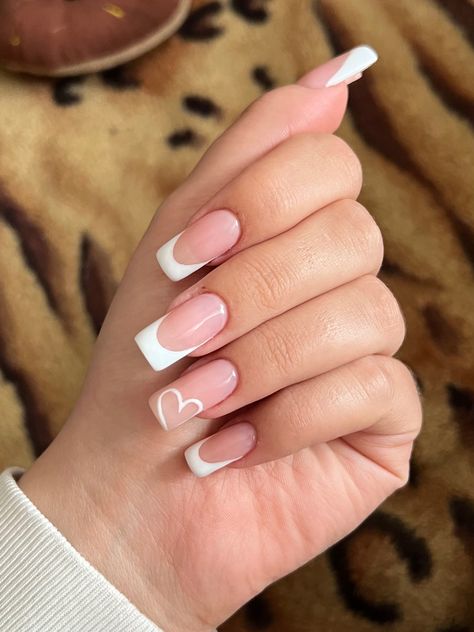 White french heart nude long square natural nails Heart In Corner Of Nail, White French With Hearts Nails, French Tip Love Heart Nails, White French Tip Nails With Heart On Ring Finger, White French Tip On Natural Nails, White French Tip With Heart Design, White Tip Valentine Nails, Square French Tip With Heart, Nail Inspo For Square Nails