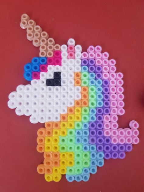 Unicorn, pastel, perler, hamma, beads Unicorn Hama Beads, Unicorn Perler Beads, Pastel Perler Bead Patterns, Perler Unicorn, Ikea Pyssla Ideas, Perler Beads Unicorn, Unicorn Perler Bead Pattern, Plastic Bead Crafts, Perler Beads Pattern