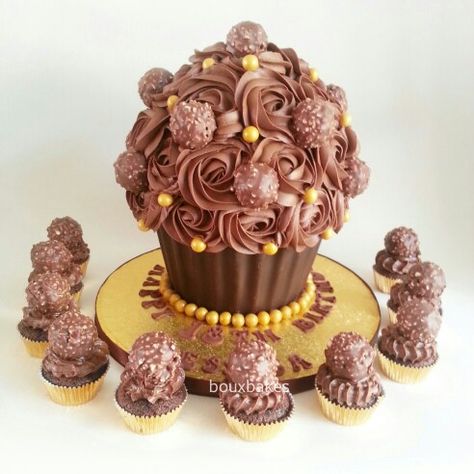 Chocolate/Ferrero Rocher/Nutella Birthday Giant Cupcake and matching mini cupcakes topped with Ferrero Rocher Bolo Cupcake, Chocolate Ferrero Rocher, Huge Cupcake, Giant Cupcake Mould, Baileys Cake, Big Cupcake, Giant Cupcake Cakes, Floral Cakes, Fancy Cupcakes