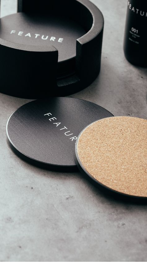 Your new coffee table accessory. Designed with a matte black finish, our FEATURE Coaster is made with a durable ceramic and a cork bottom, treated with a water-absorbent technology, perfect for all your drink necessities. ⁠ ⁠  Our FEATURE Coaster set comes with six individual coasters and a matching wooden holder. Available now at all retail locations + online. ⁠ Shop Now: https://feature.com/products/feature-coaster-black Coaster Leather, Coaster Inspiration, Metal Coaster, Leather Photography, Minimalist Coasters, Drink Coaster Design, Coffee Table Accessories, Metal Coasters, Cup Coaster