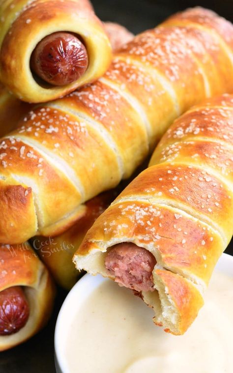 Pretzel Wrapped Hot Dogs stacked up on baking sheet with one having a bite taken from it with Maple Dijon Dipping Sauce in a white bowl Dijon Dipping Sauce, Dip For Pretzels, Dipping Sauce Recipes, Pretzel Dogs, Wrapped Hot Dogs, Will Cook For Smiles, Pretzel Dough, Hot Dogs Recipes, Bacon Dip