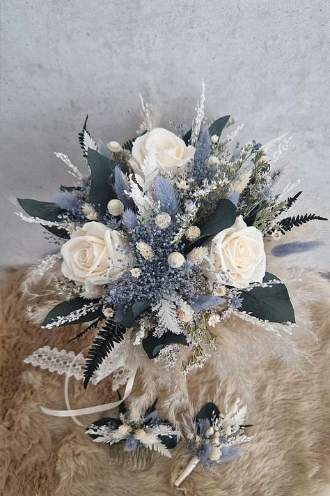 This seasonal bouquet could be charming for your big day. From my love of weddings, this floral selection pairs beautifully with any winter ceremony. Save this bouquet to your wedding board. Winter Wedding Bouquet Blue, Flower Bouquet Winter, Winter Wedding Bouquet White, Blue And Gray Wedding, Navy Wedding Bouquet, Cream Wedding Bouquet, Flower Centrepieces, Winter Ceremony, Winter Bridal Bouquets