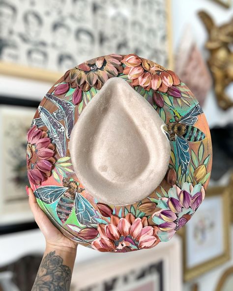 New handpainted fedora hats 🤩 A lot of you have requested more skull hats so I’ve listed a couple more. The bees wings color shift on the taupe color hat! The odds of that specific hat restocking are slim! Which one is your favorite?! 🤍 #hats #hat #fedora #fedorahat #hatstore Western fashion/ Halloween aesthetic/ bees/ butterfly/ cowgirl/ crystals/ glitter/ Disney adult/ florals/ floral/ flowers Bees Wings, Skull Hats, Hand Painted Hats, Textured Hat, Wings Color, Hats Fedora, Bee Hat, Bee Wings, Disney Adult