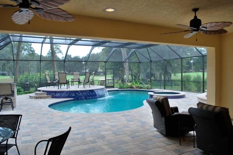 Defined by sweeping views over the surrounding golf course, this imaginative solarium boasts multiple water features, a raised, tile-enhanced deck and various lounging areas for drinks and meals. Enclosed Pool, Indoor Swimming Pool Design, Florida Pool, Living Pool, Piscina Interior, Indoor Pools, Luxury Swimming Pools, Pool Enclosures, Luxury Pools