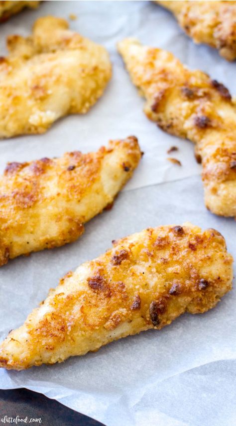 These Oven Baked Ranch Chicken Tenders are baked in the oven instead of fried. These chicken tenders are marinated with ranch dressing, giving this homemade chicken tender recipe incredible flavor! They're a total crowd pleaser.  #recipe #dinner #chicken Oven Baked Ranch Chicken, Baked Ranch Chicken Tenders, Chicken Tenders Crockpot, Ranch Chicken Tenders, Chicken Tender Recipe, Chicken Tender Recipes Baked, Ranch Dressing Chicken, Ranch Chicken Recipe, Homemade Chicken Tenders