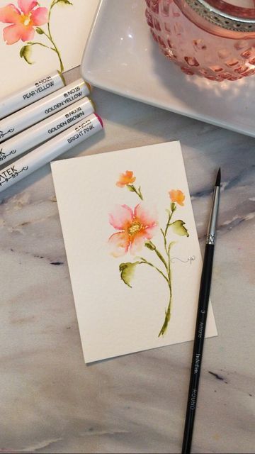 Petite Mesquite Studio/Art & Photography on Instagram: "I used my watercolor brush pens by Chromatek, but you could use traditional watercolor if you prefer. I hope you try it! 🌸 After adding those buds (honestly just yellow and pink squiggles, and a few strokes of clean water) I dotted more yellow into the center of the big flower, leaving bits of white, and then outlined the center with some golden brown dots. No water added. ☺️ You can shop my supplies on my Amazon page. Linktree in bio. - Watercolor Brush Pens, Flowers Paintings, Watercolor Brush Pen, Watercolor Brush, Watercolor Ideas, Brush Pens, Watercolor Flowers Paintings, Yellow And Pink, Watercolor Brushes