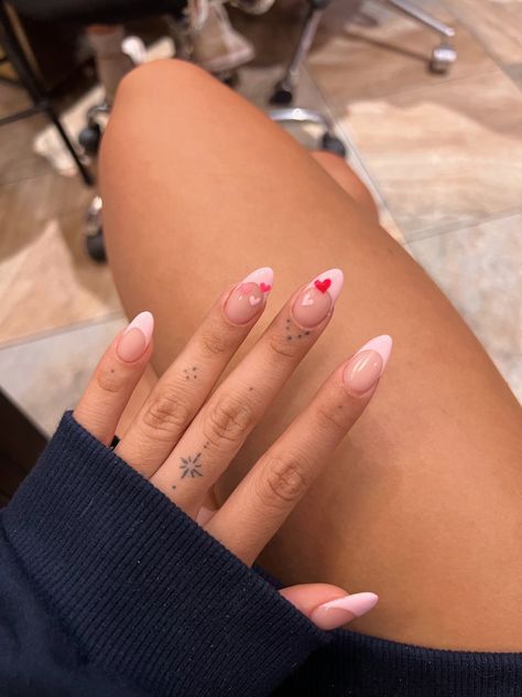 pink valentines nails with tiny hearts for vday Valentine Day Nails French Tip, Pink Nails Love Heart, Nail Inspo Acrylic Valentines, Valentines Nail Inspo Almond, Almond Simple Valentines Nails, French Tip Vday Nails, Pink French Valentine Nails, Baby Pink Valentines Nails Almond, 2 Pink Nails