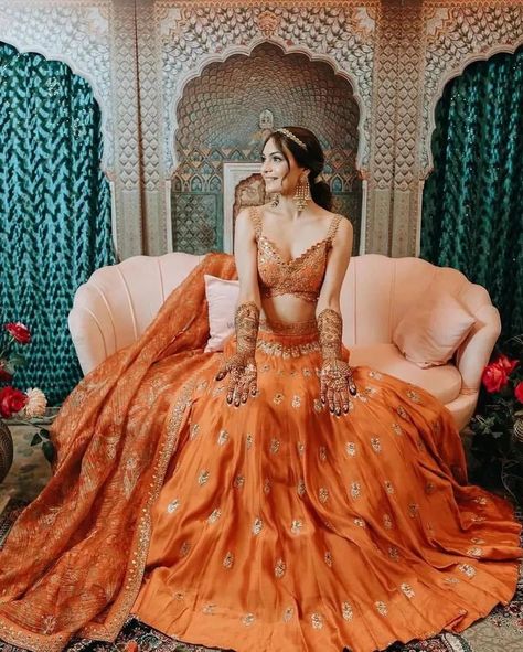 Fresh Bridal Lehenga Colours That We Spotted On The Gram Lately! | WeddingBazaar Haldi Saree Indian Bridal, Unique Mehendi Outfits For Bride, Lehenga Colours, Haldi Dresses, Indian Fits, Royal Indian Wedding, Ceremony Outfit, Haldi Dress, Orange Lehenga