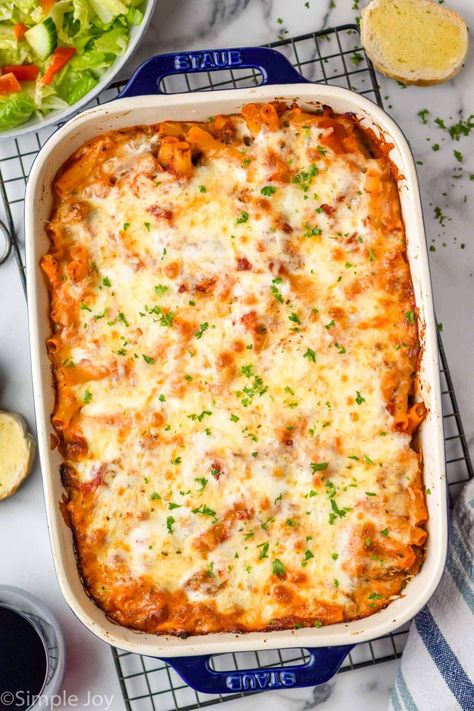 This Baked Ziti with Sausage is so comforting and delicious. My kids gobbled this up and I'm sure it will become a family favorite your house too! Sausage Baked Ziti, Ziti With Sausage, Baked Ziti With Ricotta, Baked Spaghetti And Meatballs, Baked Ziti With Sausage, Ziti Pasta, Ziti Recipes, Baked Ziti Recipe, Chicken Noodle Casserole