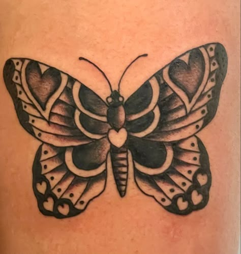 Traditional butterfly witb hearts. Work done by @tattoopaulski on instagram. American Trad Butterfly Tattoo, Butterfly With Hearts Tattoo, Butterfly American Traditional Tattoo, Folk Butterfly Tattoo, American Traditional Butterfly Tattoo Black, Butterfly With Heart Tattoo, Trad Butterfly Tattoo, Butterfly Tattoo Traditional, Butterfly Traditional Tattoo