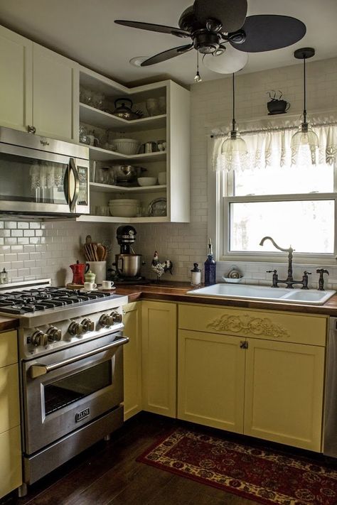 yellow and white kitchen with butcher block counter tops and white subway tile. Kitchen Yellow Tiles, White Kitchen With Butcher Block, White Kitchen With Butcher Block Counter, Hanging Pots Kitchen, Yellow And White Kitchen, Kitchen Design Rustic Modern, Kitchen Butcher Block Counters, Small House Kitchen Ideas, Yellow Tiles