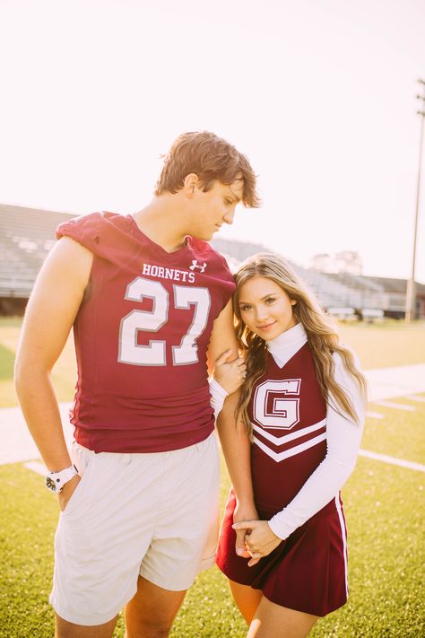 Sports Couple Photoshoot, Football And Cheer Couple Poses, Cheer And Football Couples Senior Pics, Football And Cheer Photoshoot, High School Couple Photoshoot, Couples Football Pictures, Football Couples Pictures, Cheer And Football Couples Pictures, Football And Cheerleader Pictures