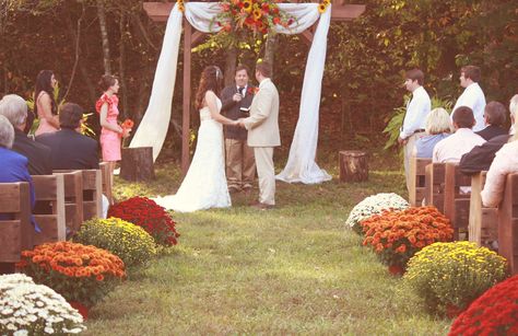 Fall Wedding Mums Aisle Wedding, Mums Wedding Alter, Mums Wedding Aisle, Outdoor Fall Wedding Ceremony Decor Aisle Decorations, Mums Down Wedding Aisle, Fall Aisle Decorations Wedding, Pumpkin Lined Wedding Aisle, Fall Wedding Isles Decoration, Fall Wedding Mums