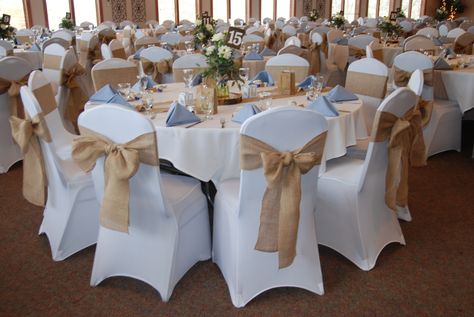 Burlap runner and chair sashes with white spandex chair covers, light blue accent color, country wedding decor, burlap decor, blue wedding, dahlia center piece, wood slabs wood table numbers, rustic but elegant, Fall wedding decor, reception decor Wedding Reception Chairs, White Chair Covers, Burlap Runners, Burlap Decor, Country Wedding Decorations, Chair Covers Wedding, Reception Chair, Anniversary Event, Chair Sashes