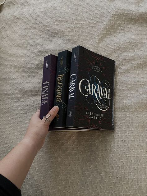 Aerial view of three books which include the Caraval series trilogy: Caraval, Legendary, and Finale. All by Stephanie Garber. Caraval Trilogy Book, Stephanie Garber Books, Caraval Trilogy, Caraval Series, Court Of Wings And Ruin, Binding 13, Stephanie Garber, Reading Motivation, Beach Read