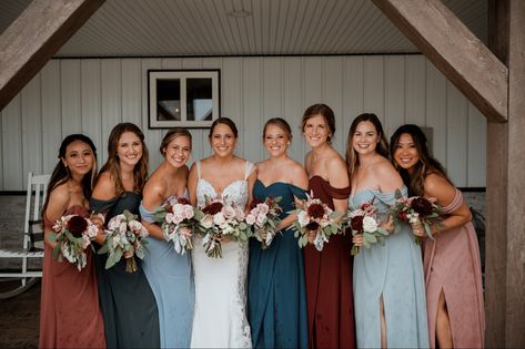 Multicolored bridesmaid dresses for a Fall wedding Blue And Terracotta Bridesmaids, Burnt Orange And Blue Bridesmaid Dresses, Blue And Copper Bridesmaid Dresses, Brown And Blue Bridesmaid Dresses, Multi Shade Bridesmaid Dresses, Multi Colour Bridesmaid Dresses, Multi Color Bridesmaid Dresses Fall, Blue And Orange Bridesmaid Dresses, Multi Coloured Bridesmaid Dresses