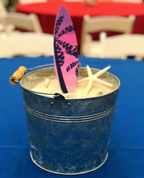 Riding the wave of style with our surfboard beach-themed centerpiece! 🏄‍♂️🌺 Bringing the ocean vibes right to your table.  #surfboard #beachtheme #surfboardcenterpiece #centerpiece #sandbucket #beachdecor #themeddecor #beachevent #themedevent #eventdecor #beach #florida Surfboard Centerpiece Ideas, Baby Boy 1st Birthday Party, Beach Events, Baby Boy 1st Birthday, Balloon Centerpieces, Ocean Vibes, Summer Birthday, Beach Themed, 1st Boy Birthday