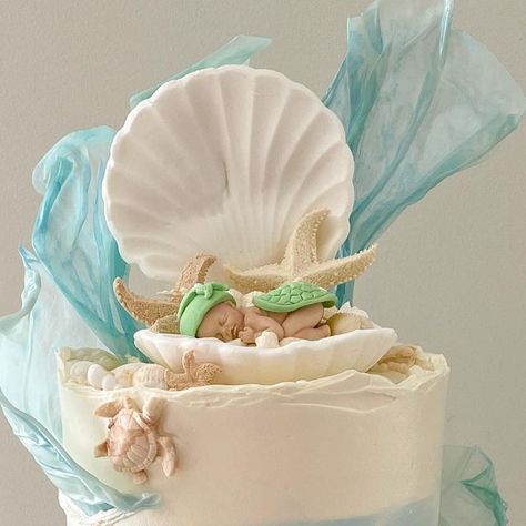 Baked by Jamaine on Instagram: "When I get to have full creative control for a ocean inspired baby shower cake and it turns out even better than I had envisioned!! 🥹 Hands down my most favourite cake I have made to date! 🤍 . . @colour.mill colours - white, baby blue, bluebell, Tiffany & caramel Baby, turtle, seahorse, seashell and starfish silicone moulds all from @okhachbakingsupplies @cakersparadise @cakebaseaus  @inspiredbyzaraz - sprinkles  . . #cake #cakedecorating #babyshowercake #oceaninspired #cakesofinstagram #buttercreamcake #baking #bakinglove #colourmillmade" Ocean Baby Shower Cake, Seashell Cake, Sprinkles Cake, Ocean Baby Showers, Caramel Baby, Beach Cakes, Silicone Moulds, Baby Shower Cake Topper, Ocean Inspired