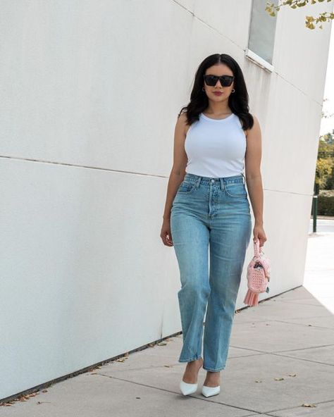 𝐉𝐄𝐒𝐄𝐍𝐈𝐀 | 📍NYC/PA content creator on Instagram: "Trend Alert! 🚨 The white tank & jeans. The white Tank Top is an unexpected trend for fall 2022 because of its simplicity, but it’s presence on the F/W22 runways can’t be denied. At Bottega Veneta, the opening look was a simple white tank and jeans. What do you think about this trend? I actually love it. I think it’s wearable and a statement piece to have." White Tank Top Jeans Outfit, Classic White Tank Top For Daywear, Tank Top And Jeans, White Tank And Jeans Photoshoot, Tank Top And Jeans Outfit, Jeans And Tank Top Outfit, Chic White Buttoned Tank Top, White Tank Top With Minimal Stretch, White Ribbed Tank Top, Casual Style