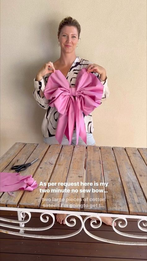 Two Minute No-Sew Bow 🎀 For Christmas, weddings or dreamy soirées… the giant bow is well and truly making a comeback right now. And as a … | Instagram Tulle Christmas Bow, Anthropology Bow Garland, How To Tie Big Bows With Ribbon, Net Bows Diy, How To Make An Extra Large Bow, Tree Top Ribbon Bow Diy, Bow Out Of Fabric, How To Make A Huge Bow With Ribbon, Diy Giant Fabric Bow