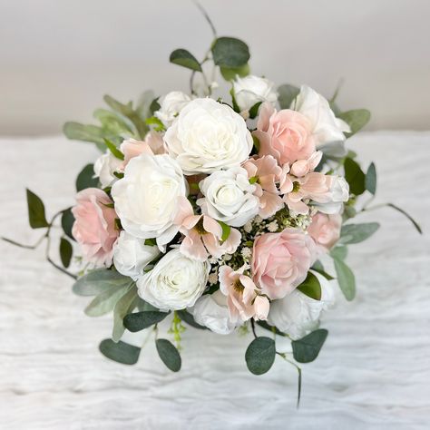 "Blush Pink and White Bridal Bouquet Collection 💕Each bouquet has blush pink cosmos and roses with realistic rose leaves - plus white babies breath and garden roses 💕Premium wedding quality artificial flowers and faux greenery including lambs ear and eucalyptus 💕3 bouquet sizes to choose from: small 9x12\", medium12x14\", large15x15\" 💕Perfect size for bride, bridesmaids & flower girls 💕Elegant blush pink and white faux florals 💕10 different satin ribbon options. Just make a note in the order personalization instructions during checkout to select your ribbon color" Peony Bridesmaid Bouquets, Pink And White Flowers Bouquet, Wedding Florals Pink And White, Blush Pink And Sage Green Wedding, Blush Pink And Champagne Wedding Bouquet, Bridal Bouquet Blush Pink And White, Cosmos Wedding Bouquet, White And Blush Pink Flowers With Eucalyptus Bouquet, February Wedding Flowers