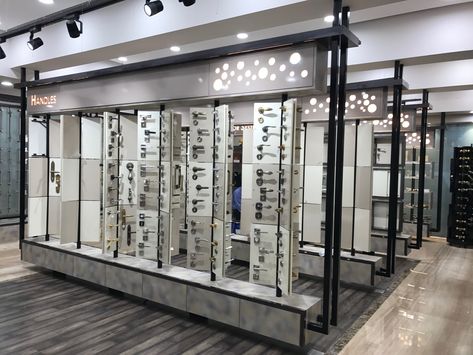 Hardware#wall#display#rotating#backlit#hanging#contemporary#modern#rustic Hardware Showroom Display Layout Plan, Hardware Showroom Display, Hardware Shop Interior Design, Interior Shop Display, Interior Design Sites, Showroom Ideas, Design Sites, Rotating Display, Showroom Display