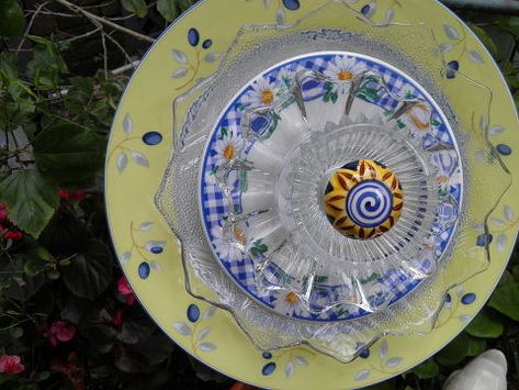 Finally Started Making My Plate Flowers and Glass Towers.....what FUN! | Hometalk Plate Flowers Garden, Recycled Garden Art, Plate Flowers, Glass Garden Flowers, Glass Plate Flowers, Lawn Art, Green Glass Bottles, Recycled Garden, Glass Garden Art