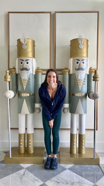 Lindsay Dean | DIY 👑 on Instagram: "DIY Nutcrackers from PVC and a cardboard tube 🤯 These were $145 each in materials from the hardware store plus whatever fun stuff you decorate them with! You literally can’t buy these to match your style more perfect for the price 😂👏🏼 hands down my favorite piece of Christmas decor in our home 🙌🏼 (thanks to @juliannamichellemiller for the original inspo!) 📢More detailed instructions: Attaching the body and legs: Two 10” 2x4s were screwed into the wood base (any size or shape base works) I cut a 12” circle out of 3/4” plywood by tracing the bottom of the cardboard tube onto the plywood. I screwed the wood circle into the bottom of the cardboard tube and that is what I screwed two more 2x4s into that you see coming out of the cardboard tube in the How To Make A Life Size Diy Nutcracker, Porch Nutcracker Diy, Diy Christmas Nutcrackers, Diy Large Nutcracker, Diy Life Sized Nutcracker, Diy Huge Nutcracker, Nutcracker Life Size, Diy Nutcracker Soldier Outdoor, Cardboard Nutcracker