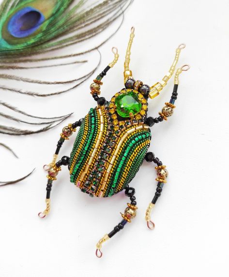 Hand embroidered bug brooch with shining chrystal, glass beads, metal thread and leather on the reverse side. Looks amazing. Worldwide shipping. Ladybird Hat, Insect Jewelry Design, Embroidery Bugs, Sewing Kit Pouch, Insect Pinning, Beetle Embroidery, Beaded Insects, Bug Brooch, Bead Brooch