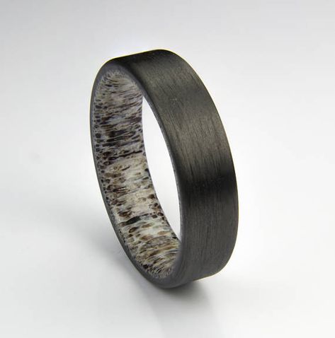 This Carbon fiber ring is handcrafted from real Carbon fiber and Elk antler. Rings shown are approx. 6 mm wide & Size 10 The ring is presented in Cherry Rosewood wood ring box. PLEASE NOTES: (1)Elk antler shade and color varies from piece to piece. Your ring may not look exactly like Elk Antler Wedding Band, Deer Antler Wedding Rings, Engagement Rings Black, Antler Rings, Antler Wedding Rings, Carbon Fiber Ring, Antler Wedding Band, Carbon Fiber Rings, Elk Antler